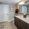 a bathroom with a shower and sink
