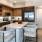 a kitchen with a bar and island
