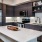 a kitchen with black cabinets