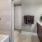 a bathroom with a tub sink and a mirror